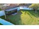 Large backyard with covered patio and privacy fence at 315 Lauderdale Ct, Kissimmee, FL 34759