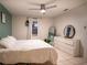 Bright bedroom with a comfortable bed, dresser and large window at 315 Lauderdale Ct, Kissimmee, FL 34759