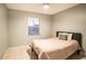 Simple bedroom with a comfortable bed and plenty of natural light at 315 Lauderdale Ct, Kissimmee, FL 34759