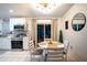 Kitchen with adjacent dining area, featuring a round table and four chairs at 315 Lauderdale Ct, Kissimmee, FL 34759