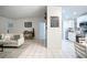 Open living room and kitchen floorplan with tiled floors and light walls at 315 Lauderdale Ct, Kissimmee, FL 34759