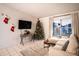 Cozy living room with a large TV, comfortable seating, and a decorated Christmas tree at 315 Lauderdale Ct, Kissimmee, FL 34759
