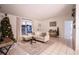 Bright living room featuring a comfortable sectional sofa and a decorated Christmas tree at 315 Lauderdale Ct, Kissimmee, FL 34759