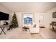Comfortable living room featuring a neutral color palette and large window at 315 Lauderdale Ct, Kissimmee, FL 34759