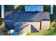 An aerial view of a house showing the gray asphalt shingle roof at 315 Lauderdale Ct, Kissimmee, FL 34759