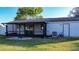 Screened porch with sliding glass doors, offering additional outdoor space at 315 Lauderdale Ct, Kissimmee, FL 34759