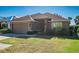 House exterior showcasing a two-car garage and manicured lawn at 4027 Island Lakes Dr, Winter Haven, FL 33881