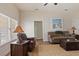 Living room with brown sofa, armchair, and coffee table at 4027 Island Lakes Dr, Winter Haven, FL 33881