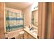 Clean bathroom with tub shower combo and vanity at 408 Country Ne Ln # 408, Winter Haven, FL 33881