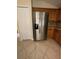 Kitchen features stainless steel refrigerator and wood cabinetry at 4150 Bedford Ave, Winter Haven, FL 33884