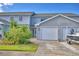 Two-story townhouse with double garage and landscaping at 418 Orange Blossom Dr # 19, Winter Haven, FL 33880