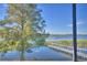 Lake view from screened porch with dock visible at 418 Orange Blossom Dr # 19, Winter Haven, FL 33880