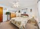 Bedroom with a queen-size bed and wicker furniture at 422 21St Sw St, Winter Haven, FL 33880