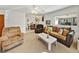 Living room with comfortable seating and view into dining area at 422 21St Sw St, Winter Haven, FL 33880