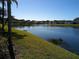 Houses along a tranquil lake with lush green landscaping at 4329 Whistlewood Cir, Lakeland, FL 33811