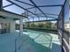 Large screened pool with spa and covered patio at 5340 Nicklaus Dr, Winter Haven, FL 33884