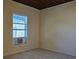 A bedroom with a window and wall a/c unit at 616 Pine St, Auburndale, FL 33823