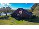 Aerial view of home on large lot with lake at 703 Lake Ada Blvd, Dundee, FL 33838