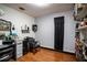 A well-lit beauty room with a vanity and shelving at 703 Lake Ada Blvd, Dundee, FL 33838