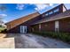 Brown house with a unique roofline and landscaping at 703 Lake Ada Blvd, Dundee, FL 33838