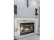 Cozy fireplace with a modern design and built in shelving at 817 Carlton Ct, Winter Haven, FL 33884