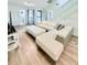 Bright and airy living room with L-shaped sofa and wood floors at 940 Fenton Ln # 6, Lakeland, FL 33809