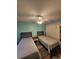 Guest bedroom with two twin beds and ceiling fan at 1072 Old Cutler Rd, Lake Wales, FL 33898