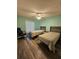 Guest bedroom with two twin beds and ceiling fan at 1072 Old Cutler Rd, Lake Wales, FL 33898