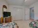 Guest bedroom with twin beds, TV, and ample closet space at 1072 Old Cutler Rd, Lake Wales, FL 33898