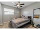 Second bedroom with a full-size bed and ceiling fan at 128 Hawthorne Rd, Winter Haven, FL 33884