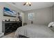 Main bedroom with TV and dresser at 128 Hawthorne Rd, Winter Haven, FL 33884