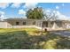 Back of house with sunroom and detached garage at 128 Hawthorne Rd, Winter Haven, FL 33884