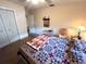 Bedroom featuring carpeted floors, ceiling fan, and closet at 128 Stevenson Rd, Winter Haven, FL 33884