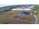 Aerial view of a home on a large lot with detached buildings at 135 Mi Rancho Rd, Davenport, FL 33837