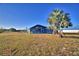 View of the home from the backyard at 135 Mi Rancho Rd, Davenport, FL 33837