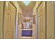 Bathroom hallway with walk-in shower and access to other rooms at 135 Mi Rancho Rd, Davenport, FL 33837