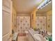 Bright bathroom with floral shower curtain at 135 Mi Rancho Rd, Davenport, FL 33837