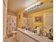 Clean bathroom with floral shower curtain at 135 Mi Rancho Rd, Davenport, FL 33837