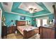 Spacious bedroom with wood furniture and access to a patio at 135 Mi Rancho Rd, Davenport, FL 33837