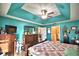 Spacious bedroom with wood furniture and ceiling fan at 135 Mi Rancho Rd, Davenport, FL 33837