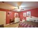 Bedroom with a queen bed and ceiling fan at 135 Mi Rancho Rd, Davenport, FL 33837