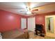 Bedroom with double doors and ceiling fan at 135 Mi Rancho Rd, Davenport, FL 33837