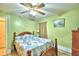 Light green bedroom with double bed at 135 Mi Rancho Rd, Davenport, FL 33837