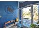 Front entry with a bench and view of the backyard at 135 Mi Rancho Rd, Davenport, FL 33837
