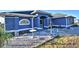 Charming one-story home with landscaped yard and blue exterior at 135 Mi Rancho Rd, Davenport, FL 33837