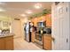 Kitchen with light wood cabinets and stainless steel appliances at 135 Mi Rancho Rd, Davenport, FL 33837