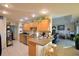 Well-equipped kitchen with light wood cabinets at 135 Mi Rancho Rd, Davenport, FL 33837