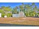 Metal shed and barn in the backyard at 135 Mi Rancho Rd, Davenport, FL 33837