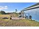 Cozy patio area with seating and grill at 135 Mi Rancho Rd, Davenport, FL 33837