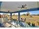 Relaxing screened porch with scenic views and ceiling fans at 135 Mi Rancho Rd, Davenport, FL 33837